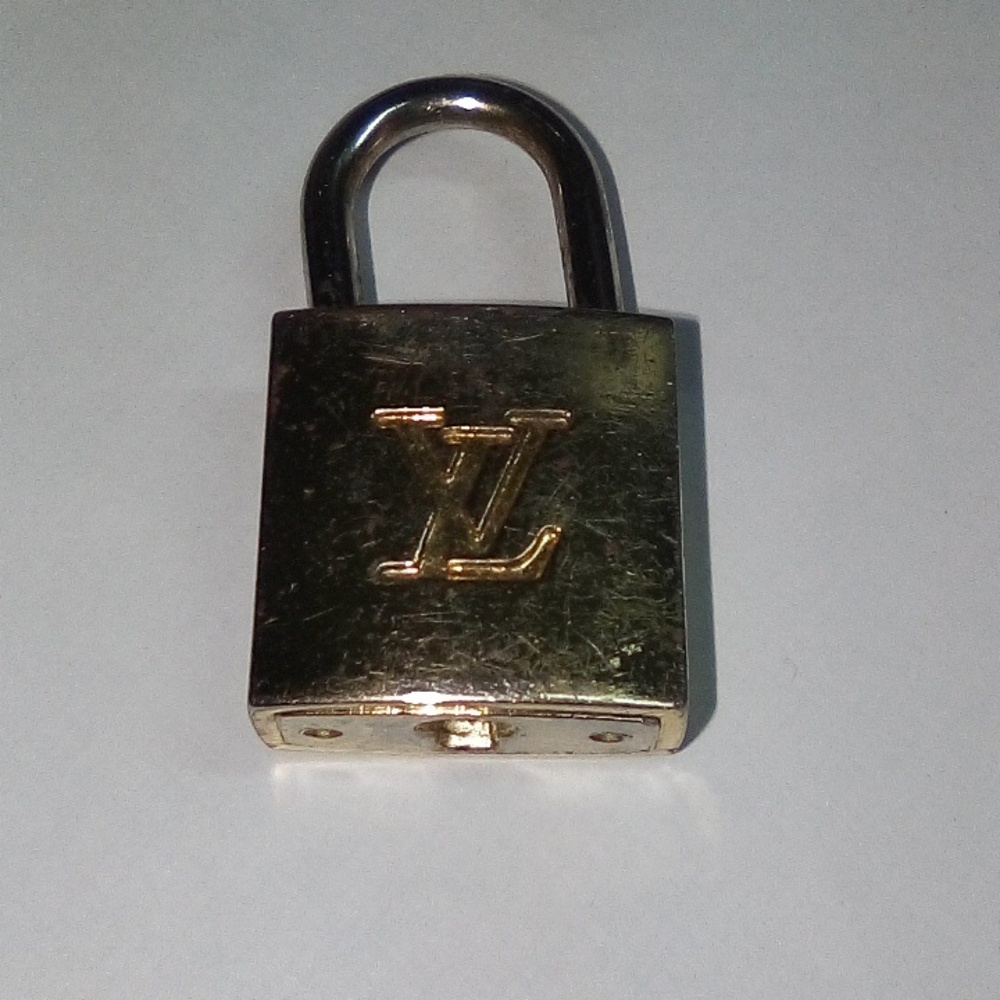 Louis Vuitton Shiny Gold Little Lock Sold On Handbags